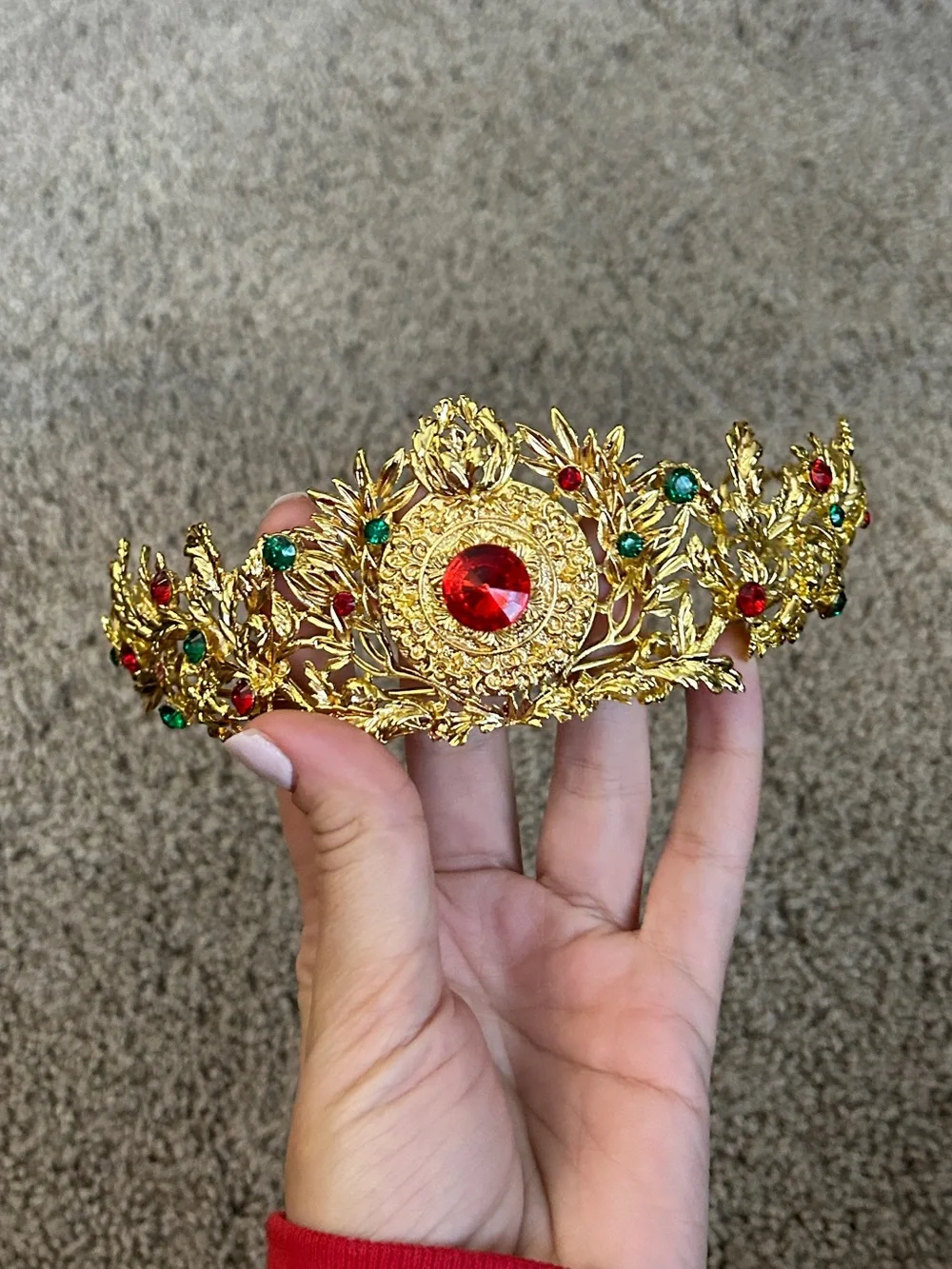 Gold colored crown headband with red and green faux gemstones